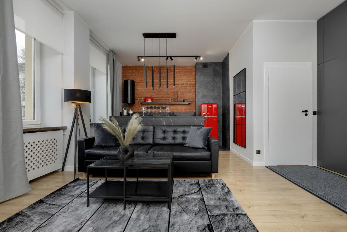 Exclusive Grey and Red Apartment in Warsaw Center by Noclegi Renters