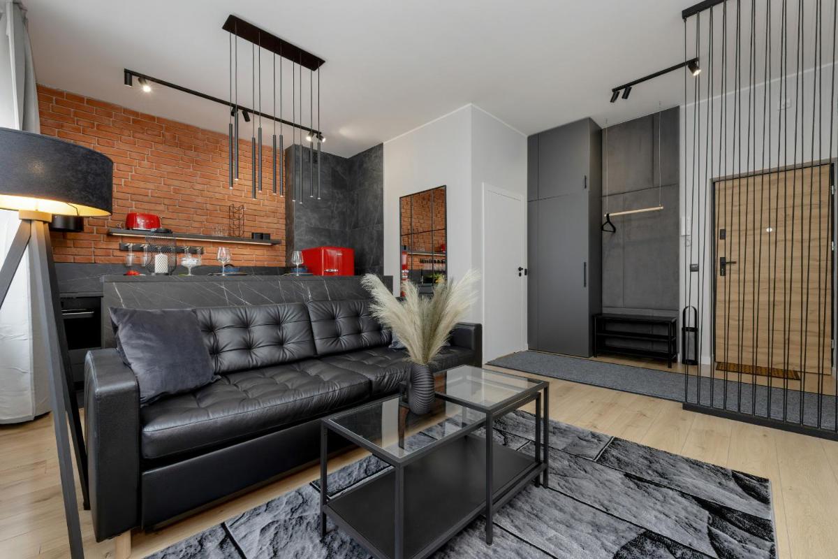 Exclusive Grey and Red Apartment in Warsaw Center by Noclegi Renters