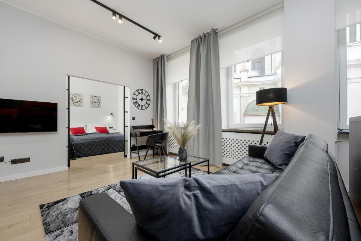 Exclusive Grey and Red Apartment in Warsaw Center by Noclegi Renters